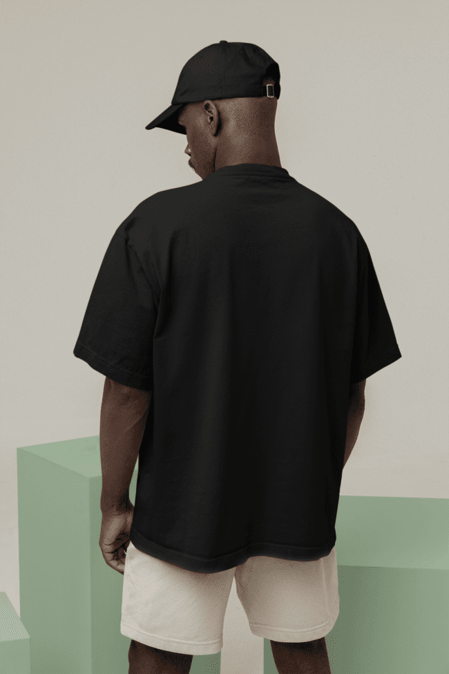 back view mockup of a man wearing an oversized tee m26648 min 2