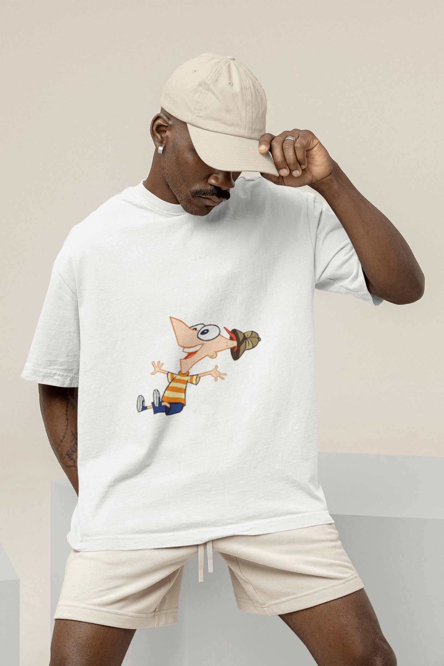 mockup of a man wearing a wide t shirt at a studio m26233 min