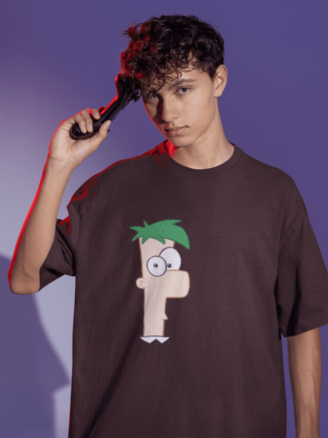 oversized tee mockup of a man posing with a game controller to his head m28457 min