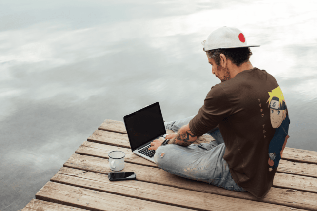 back view tee mockup of a man with an arm tattoo working outdoors m9073 r el2 3