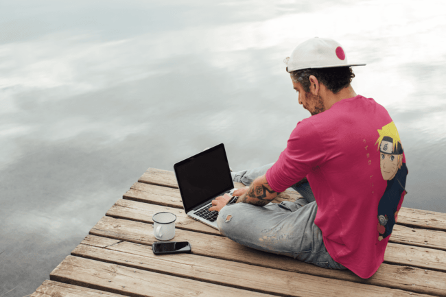 back view tee mockup of a man with an arm tattoo working outdoors m9073 r el2 4