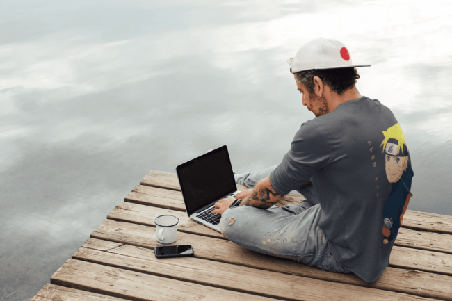 back view tee mockup of a man with an arm tattoo working outdoors m9073 r el2 5