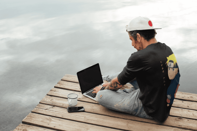 back view tee mockup of a man with an arm tattoo working outdoors m9073 r el2 7