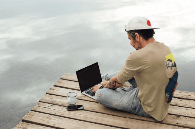 back view tee mockup of a man with an arm tattoo working outdoors m9073 r el2 9