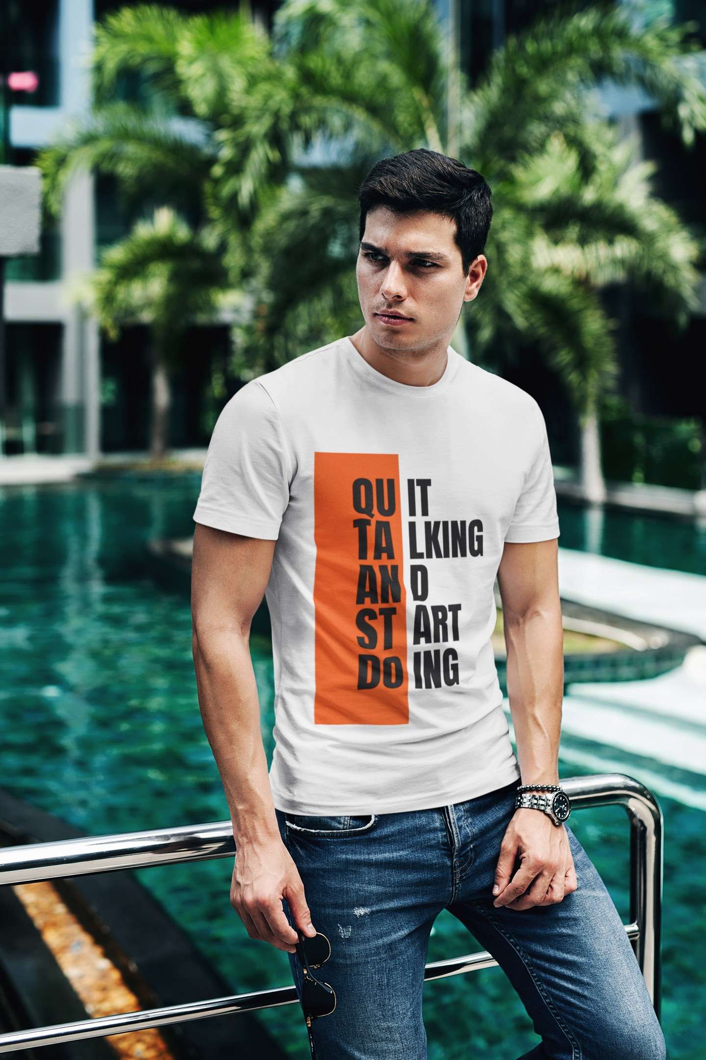 t shirt mockup of a fashionable man posing by a pool 430 el